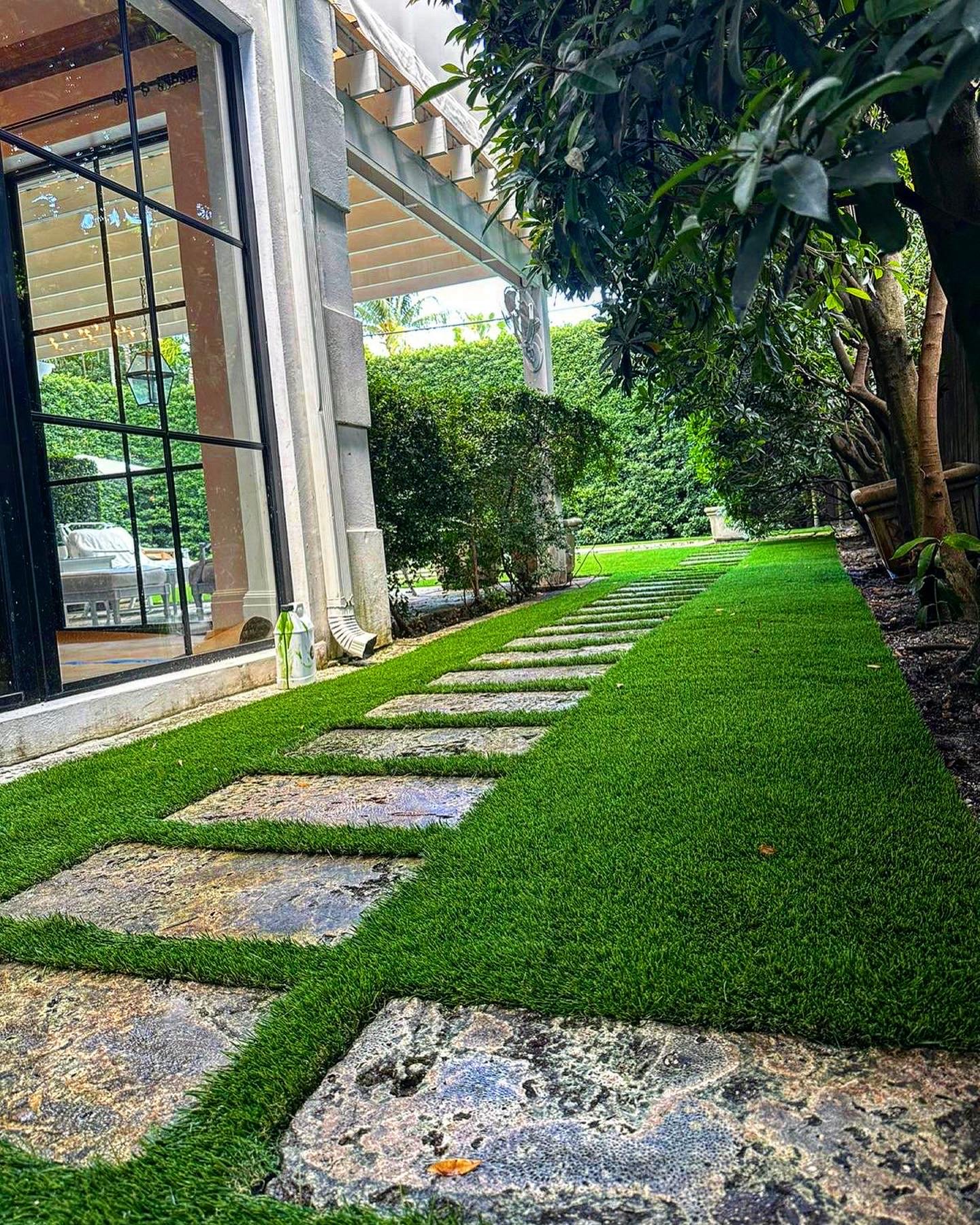 Travertine and Turf Patio Travertine patio with artificial grass