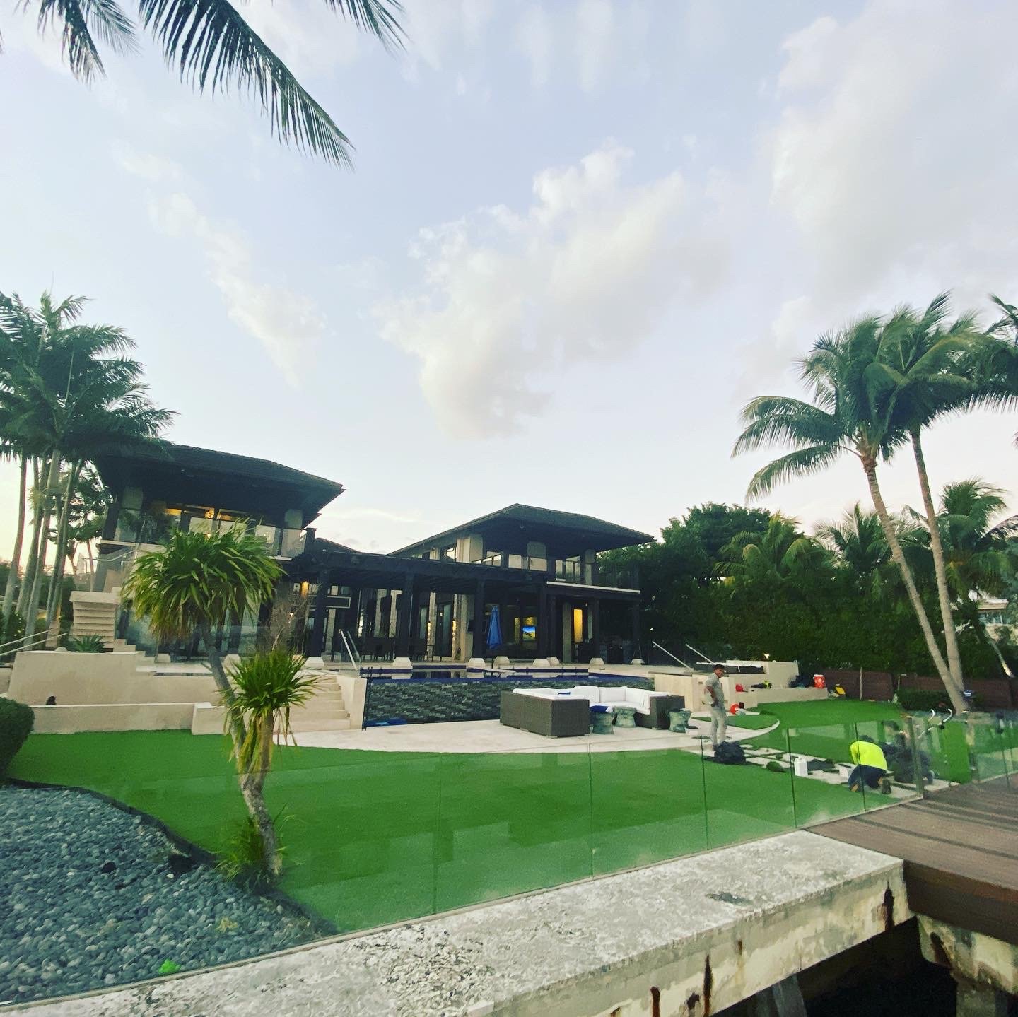 water front home artificial turf installation luxury home artificial grass installation artificial landscaping installation grama artificial